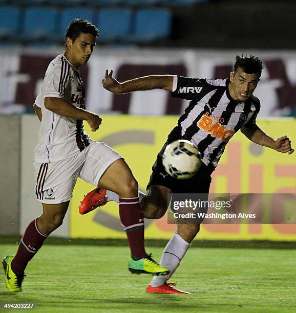 Jesus Datolo of Atletico MG struggles for the ball with Jean of Fluminense during a match between Atletico MG and Fluminense as part of Brasileirao...