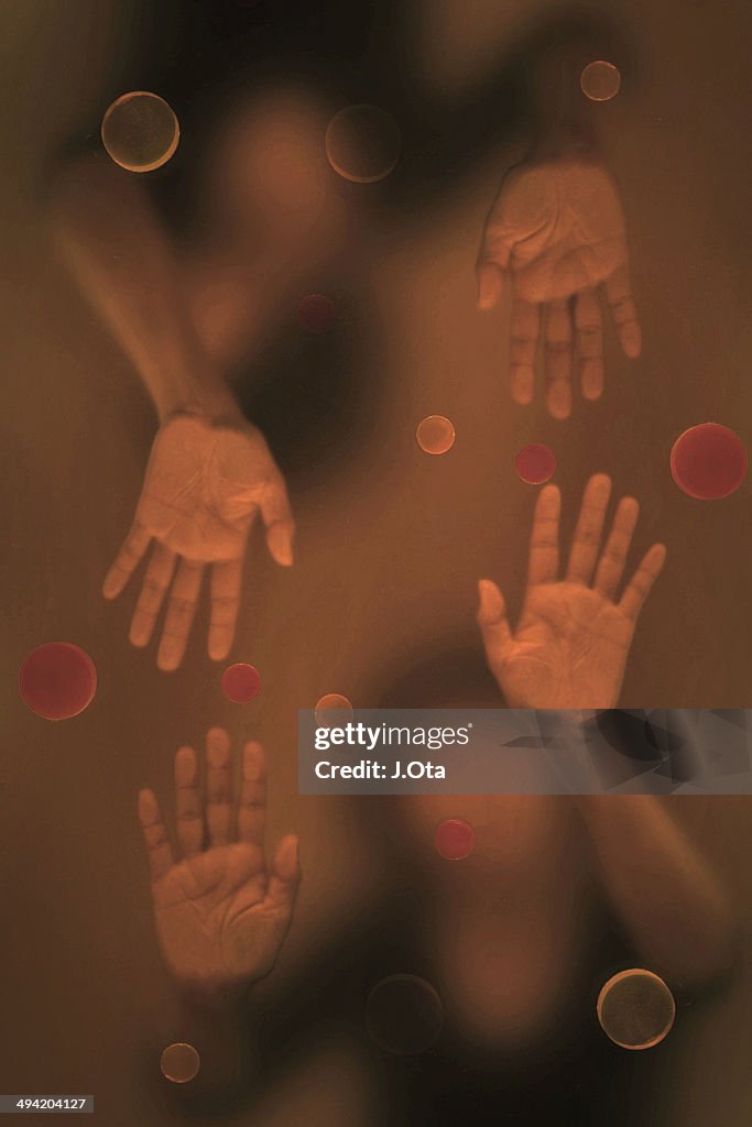 Hands on the glass