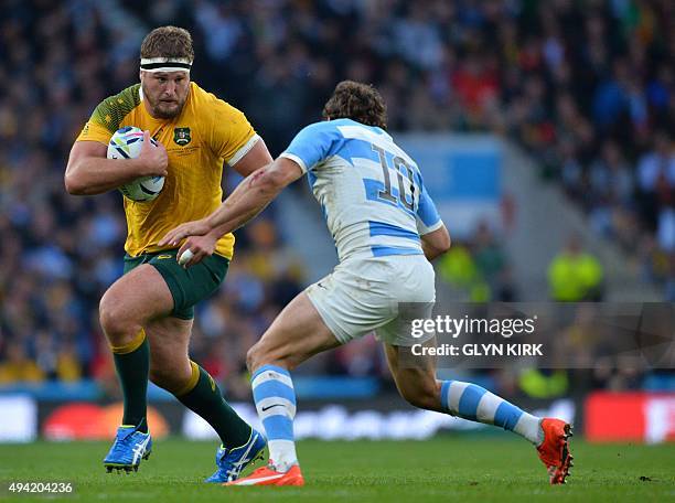 Australia's prop James Slipper runs to evade Argentina's fly half Nicolas Sanchez during a semi-final match of the 2015 Rugby World Cup between...