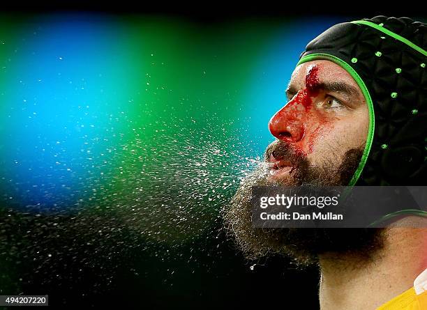 Bloodied Scott Fardy of Australia spits during the 2015 Rugby World Cup Semi Final match between Argentina and Australia at Twickenham Stadium on...