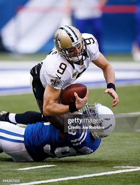 Drew Brees of the New Orleans Saints is sacked by Robert Mathis of the Indianapolis Colts at Lucas Oil Stadium on October 25, 2015 in Indianapolis,...