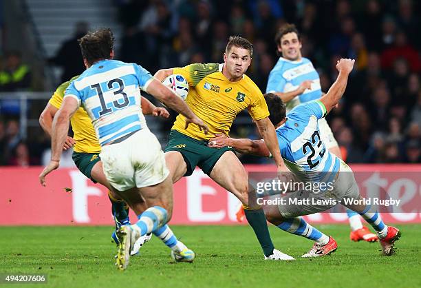 Drew Mitchell of Australia is tackled by Lucas Gonzalez Amorosino of Argentina during the 2015 Rugby World Cup Semi Final match between Argentina and...