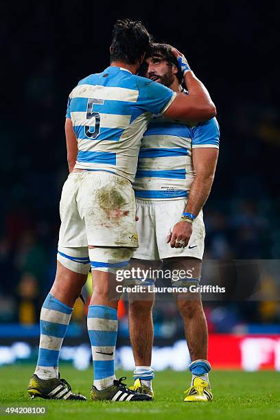 Tomas Lavanini commiserates with Juan Martin Fernandez Lobbe of Argentina at the final whistle during the 2015 Rugby World Cup Semi Final match...