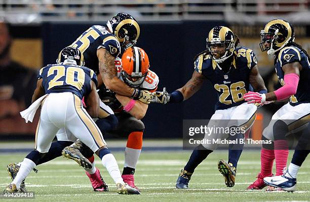 Gary Barnidge of the Cleveland Browns is tackled by James Laurinaitis of the St. Louis Rams in the first quarter at the Edward Jones Dome on October...