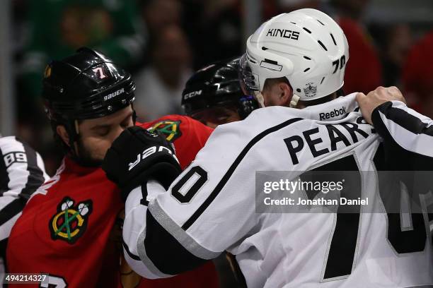 Tanner Pearson of the Los Angeles Kings fights with Brent Seabrook of the Chicago Blackhawks during Game Five of the Western Conference Final in the...