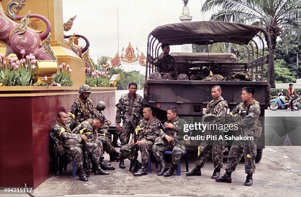 Thai soldiers stand guard at the Royal Plaza in Bangkok. Thailand's armed forces led by Thai army chief General Sonthi Boonyaratglin seized power on...