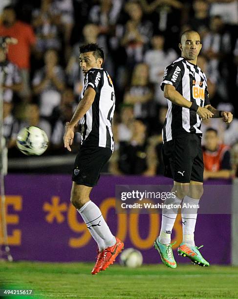 Diego Tardelli and Jesus Datolo of Atletico MG in action during a match between Atletico MG and Fluminense as part of Brasileirao Series A 2014 at...