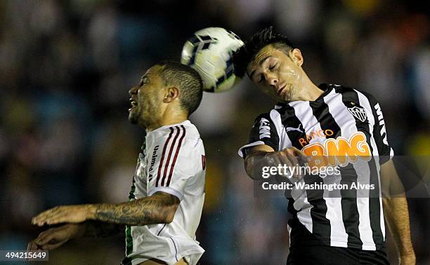 Jesus Datolo of Atletico MG struggles for the ball with Bruno of Fluminense during a match between Atletico MG and Fluminense as part of Brasileirao...