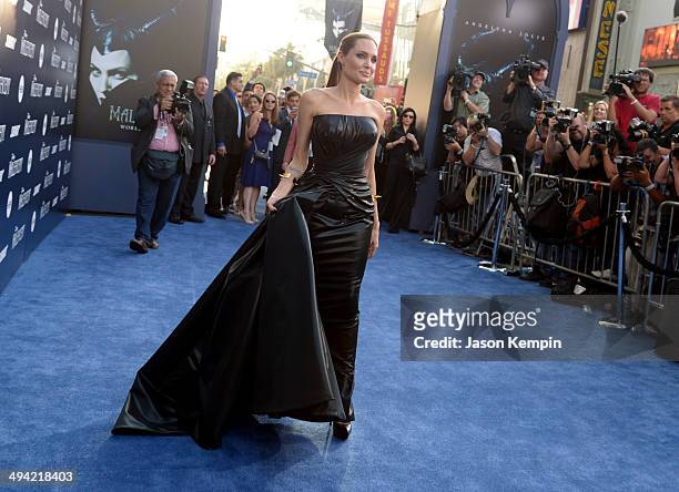 Actors Brad Pitt and Angelina Jolie attend the World Premiere of Disney's "Maleficent", starring Angelina Jolie, at the El Capitan Theatre on May 28,...