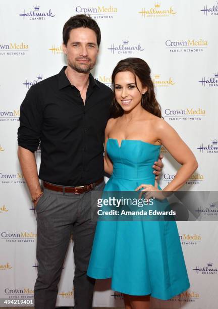 Actor Warren Christie and actress Lacey Chabert arrive at "The Color Of Rain" premiere screening presented by the Hallmark Movie Channel at The Paley...