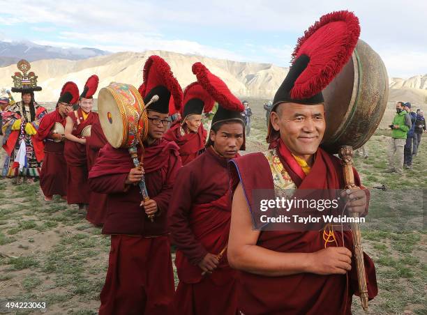 Monks return to the city after performing ceremonies in a nearby field during the Tenchi Festival on May 27, 2014 in Lo Manthang, Nepal. The Tenchi...