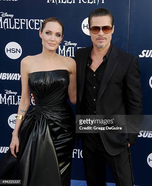 Actors Angelina Jolie and Brad Pitt arrive at the World Premiere Of Disney's "Maleficent" at the El Capitan Theatre on May 28, 2014 in Hollywood,...