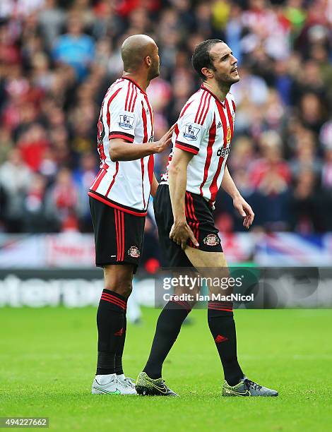 John O'Shea of Newcastle United goes off injured during the Barclays Premier League match between Sunderland and Newcastle at The Stadium of Light on...