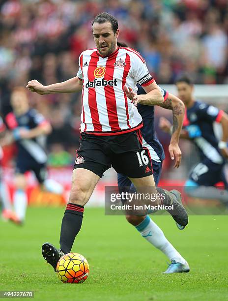 John O'Shea of Newcastle United controls the ball during the Barclays Premier League match between Sunderland and Newcastle at The Stadium of Light...