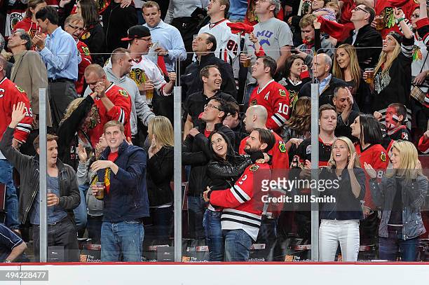 Engaged WWE wrestlers AJ Lee and CM Punk celebrate after the Chicago Blackhawks scored against the Los Angeles Kings in Game Five of the Western...