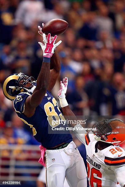 Brian Quick of the St. Louis Rams attempts to catch a pass while under pressure from Pierre Desir of the Cleveland Browns in the second quarter at...