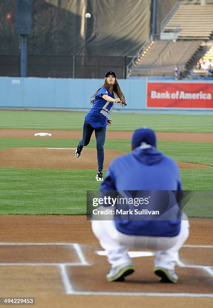 Korean singer/actress Bae Suzy, aka SUZY throws out the ceremonial first pitch before the game between the Los Angeles Dodgers and Cincinnati Reds at...