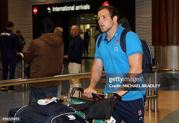 Henry Thomas from the English rugby team arrives at Auckland International Airport in Auckland on May 29, 2014. England's rugby team is in New...