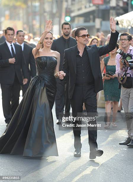 Actors Angelina Jolie and Brad Pitt attend the World Premiere of Disney's 'Maleficent' at the El Capitan Theatre on May 28, 2014 in Hollywood,...