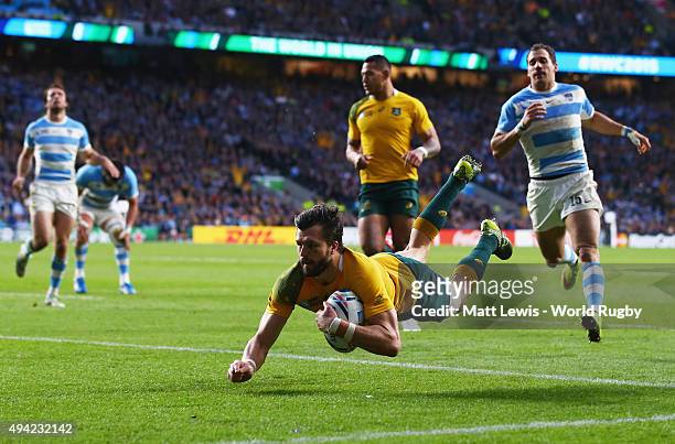 Adam Ashley-Cooper of Australia goes over to score their third try during the 2015 Rugby World Cup Semi Final match between Argentina and Australia...