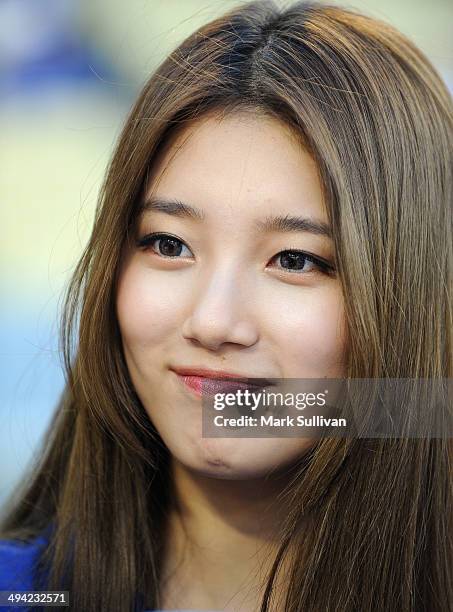 Korean singer/actress Bae Suzy, aka SUZY on the field to throw out the ceremonial first pitch before the game between the Los Angeles Dodgers and...