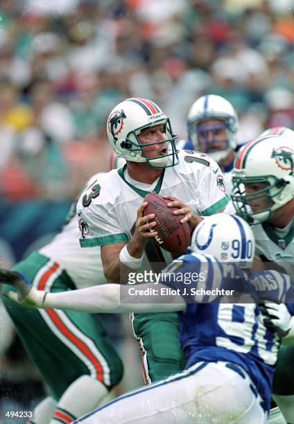 Dan Marino of the Miami Dolphins moves to pass the ball during a game against the Indianapolis Colts at the Pro Player Stadium in Miami, Florida. The...