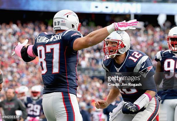 Tom Brady and Rob Gronkowski of the New England Patriots react after Gronkowski scored a touchdown during the fourth quarter against the New York...