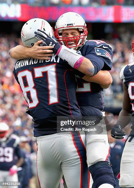 Tom Brady and Rob Gronkowski of the New England Patriots react after Gronkowski scored a touchdown during the fourth quarter against the New York...