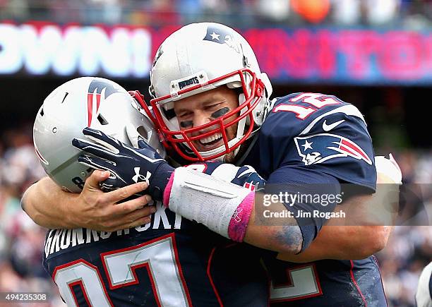 Tom Brady and Rob Gronkowski of the New England Patriots react after Gronkowski scored a touchdown during the fourth quarter against the New York...