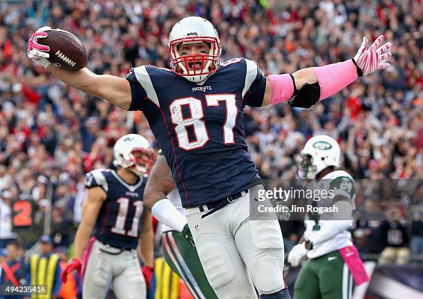 Rob Gronkowski of the New England Patriots reacts after scoring a touchdown during the fourth quarter against the New York Jets at Gillette Stadium...