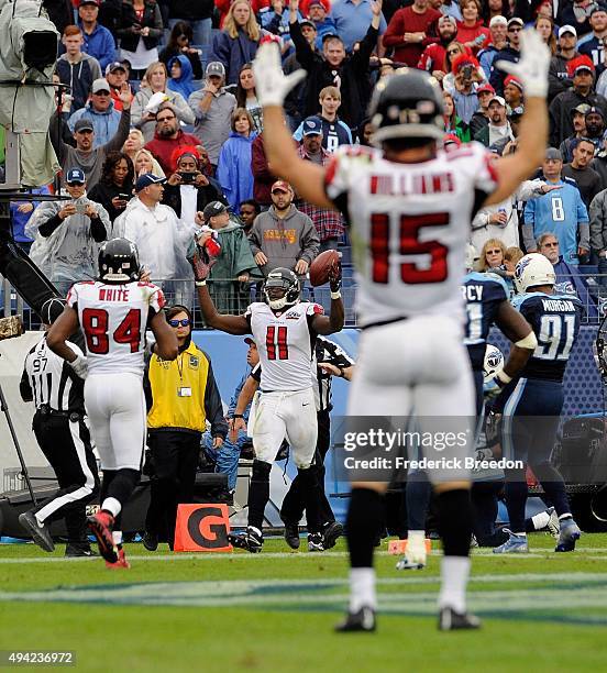 Nick Williams and Roddy White of the Atlanta Falcons celebrate after teammate Julio Jones appeared to have made a touchdown reception against the...