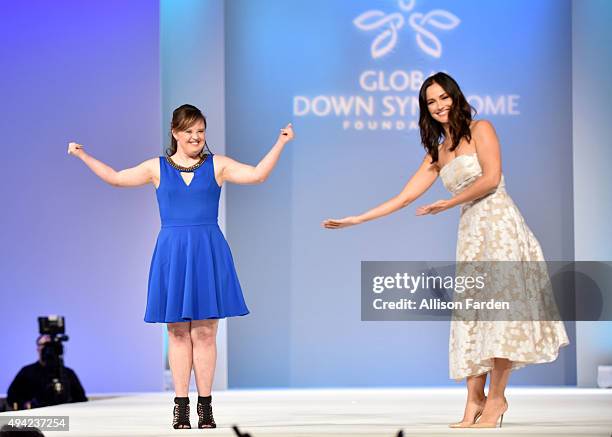 Actress Jamie Brewer walks the runway with actress Minka Kelly at "Be Beautiful Be Yourself" Global Down Syndrome Foundation Fashion Show 2015 held...