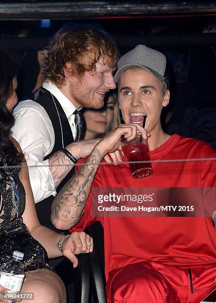 Justin Bieber watches the show with Ed Sheeran from the Glamour pit during the MTV EMA's 2015 at the Mediolanum Forum on October 25, 2015 in Milan,...