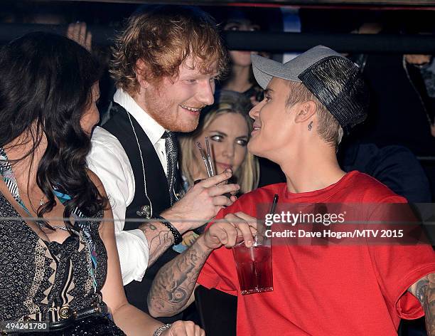 Justin Bieber watches the show with Ed Sheeran from the Glamour pit during the MTV EMA's 2015 at the Mediolanum Forum on October 25, 2015 in Milan,...