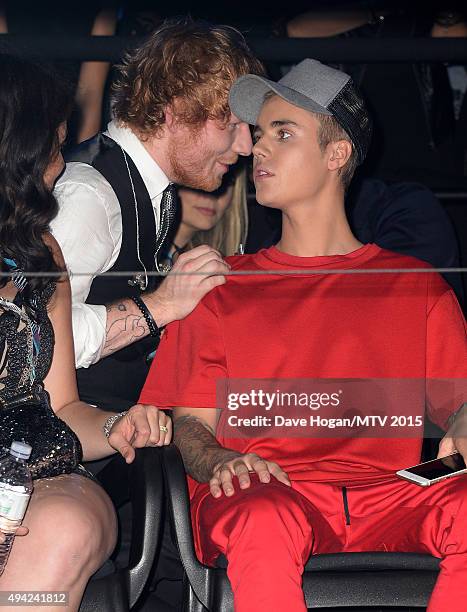 Justin Bieber watches the show with Ed Sheeran from the Glamour pit during the MTV EMA's 2015 at the Mediolanum Forum on October 25, 2015 in Milan,...