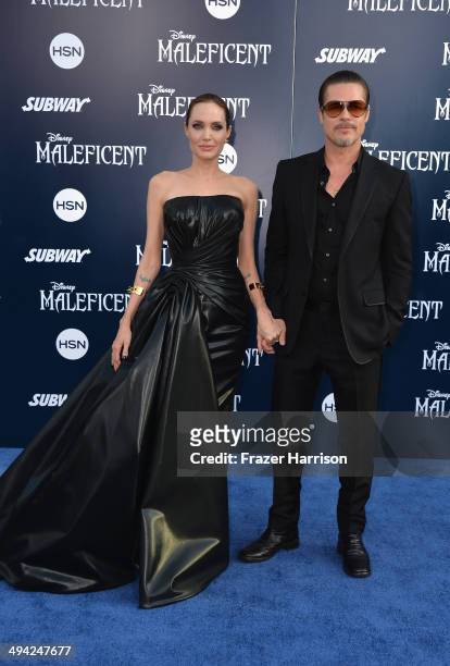Actress Angelina Jolieand Brad Pitt arrive at the World Premiere Of Disney's "Maleficent" at the El Capitan Theatre on May 28, 2014 in Hollywood,...