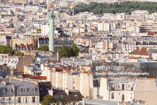 the rooftops of paris. - bastille paris stock-fotos und bilder