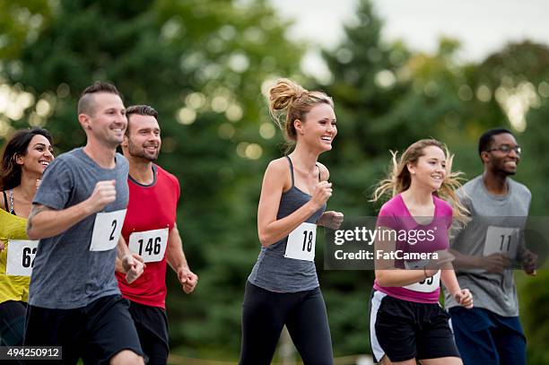 athletes jogging in a race together - 10000m bildbanksfoton och bilder