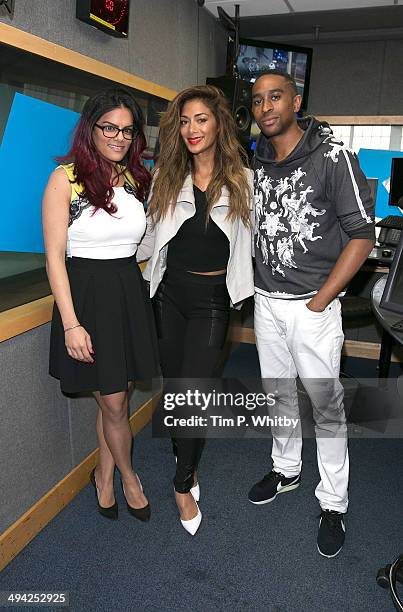 Nicole Scherzinger poses with Neve and AJ during a visit to Kiss FM Studio's on May 29, 2014 in London, England.