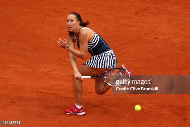 Jelena Jankovic of Serbia returns a shot during her women's singles match against Kurumi Nara of Japan on day five of the French Open at Roland...