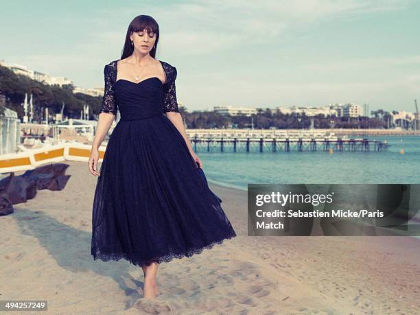 Monica Bellucci wearing a Dolce Gabbana dress is photographed for Paris Match on the beach of the Hotel Martinez during the 67th Cannes Film Festival...