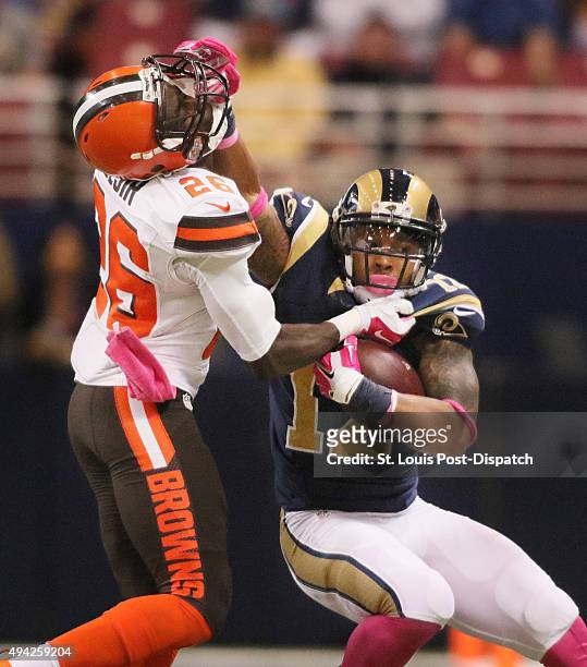 St. Louis Rams wide receiver Stedman Bailey tries to fend off Cleveland Browns defensive back Pierre Desir after an eight-yard reception during...