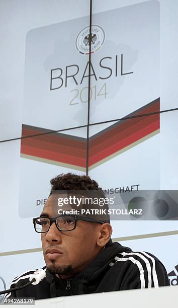 Germany's national football team defender Jerome Boateng takes part in a press conference on a training ground in San Martino in Passiria, Italy, on...