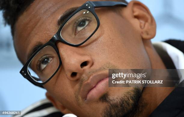 Germany's national football team defender Jerome Boateng takes part in a press conference on a training ground in San Martino in Passiria, Italy, on...