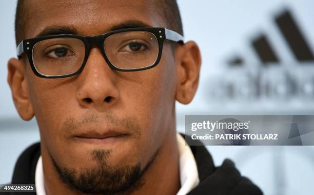 Germany's national football team defender Jerome Boateng takes part in a press conference on a training ground in San Martino in Passiria, Italy, on...