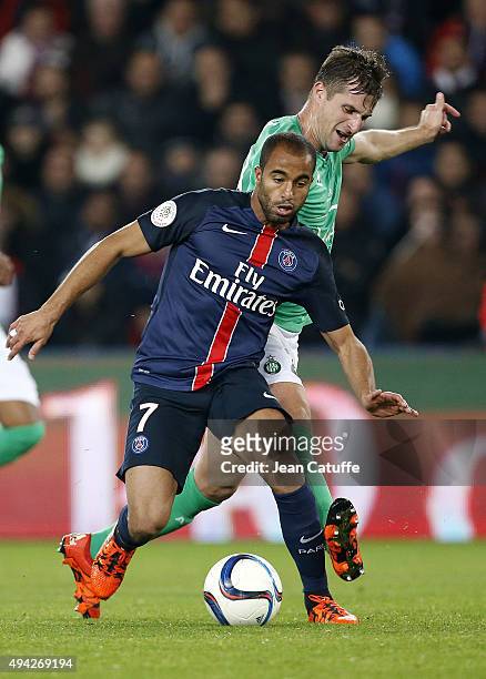 Lucas Moura of PSG and Francois Clerc of Saint-Etienne in action during the French Ligue 1 match between Paris Saint-Germain and AS Saint-Etienne at...