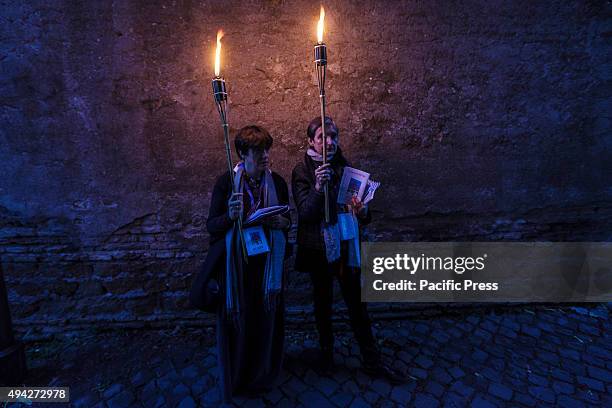 Thousands of Gypsies attend celebrations of the Via Crucis outside the Colosseum in Rome, to mark the 50th anniversary of the historic visit of Pope...