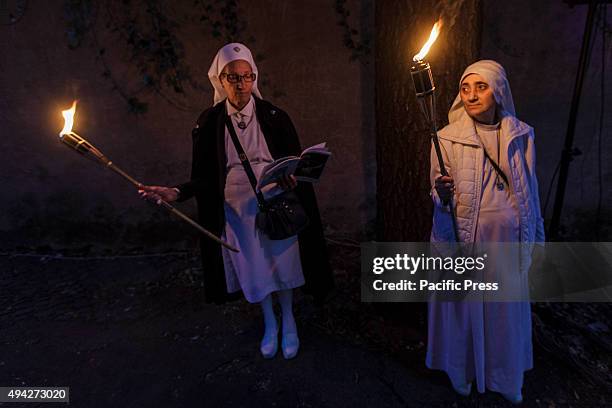 Thousands of Gypsies attend celebrations of the Via Crucis outside the Colosseum in Rome, to mark the 50th anniversary of the historic visit of Pope...