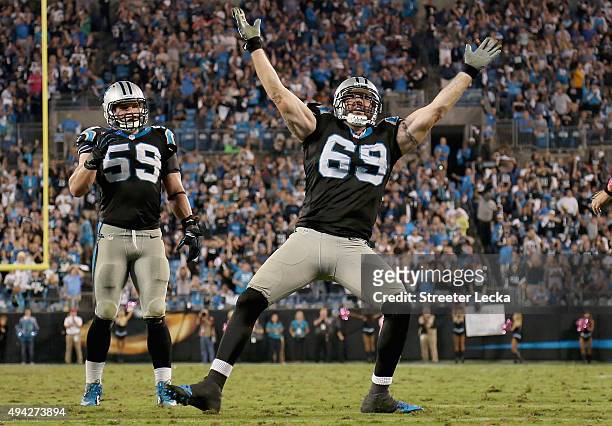 Jared Allen of the Carolina Panthers celebrates a 4th quarter sack against the Philadelphia Eagles while Luke Kuechly looks on during their game at...