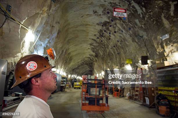 State-certified mine technician Christopher Wilson helps maintain the structural integrity of the Hazel-Atlas Mine, a long-dormant operation that...